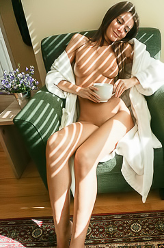 Slender Nude Body & Drinking Coffee On Sofa
