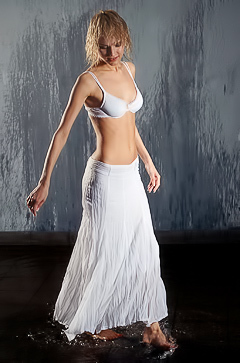 Irma Scatti Entices In A Wet White Skirt Against A Dark Backdrop And Tantalizing Poses